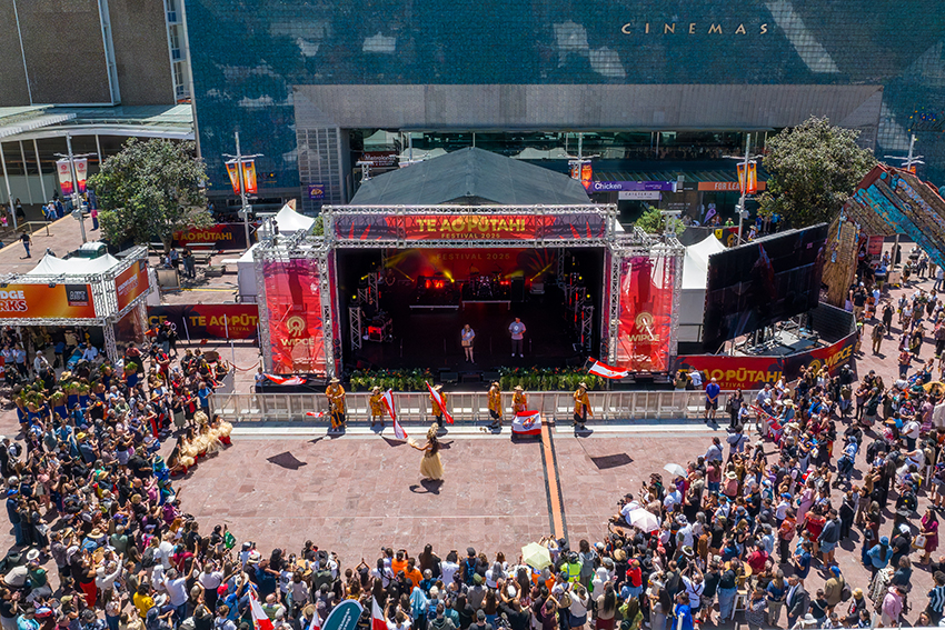 A drone shot of the stage and crowd at Te Ao Pūtahi Festival.