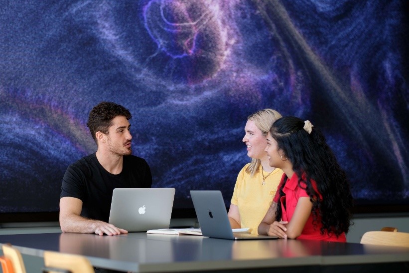 Team of students discussing ideas at AUT