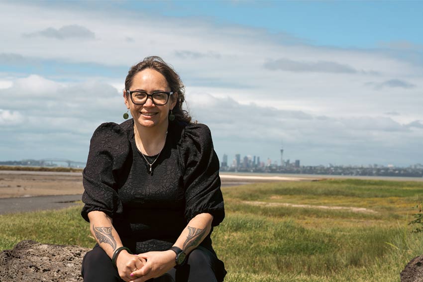 AUT Dr Hazel smiling with blue sky backdrop.