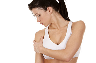 woman nursing a painful shoulder